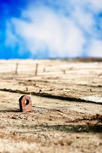 Close-up of pipe on sand