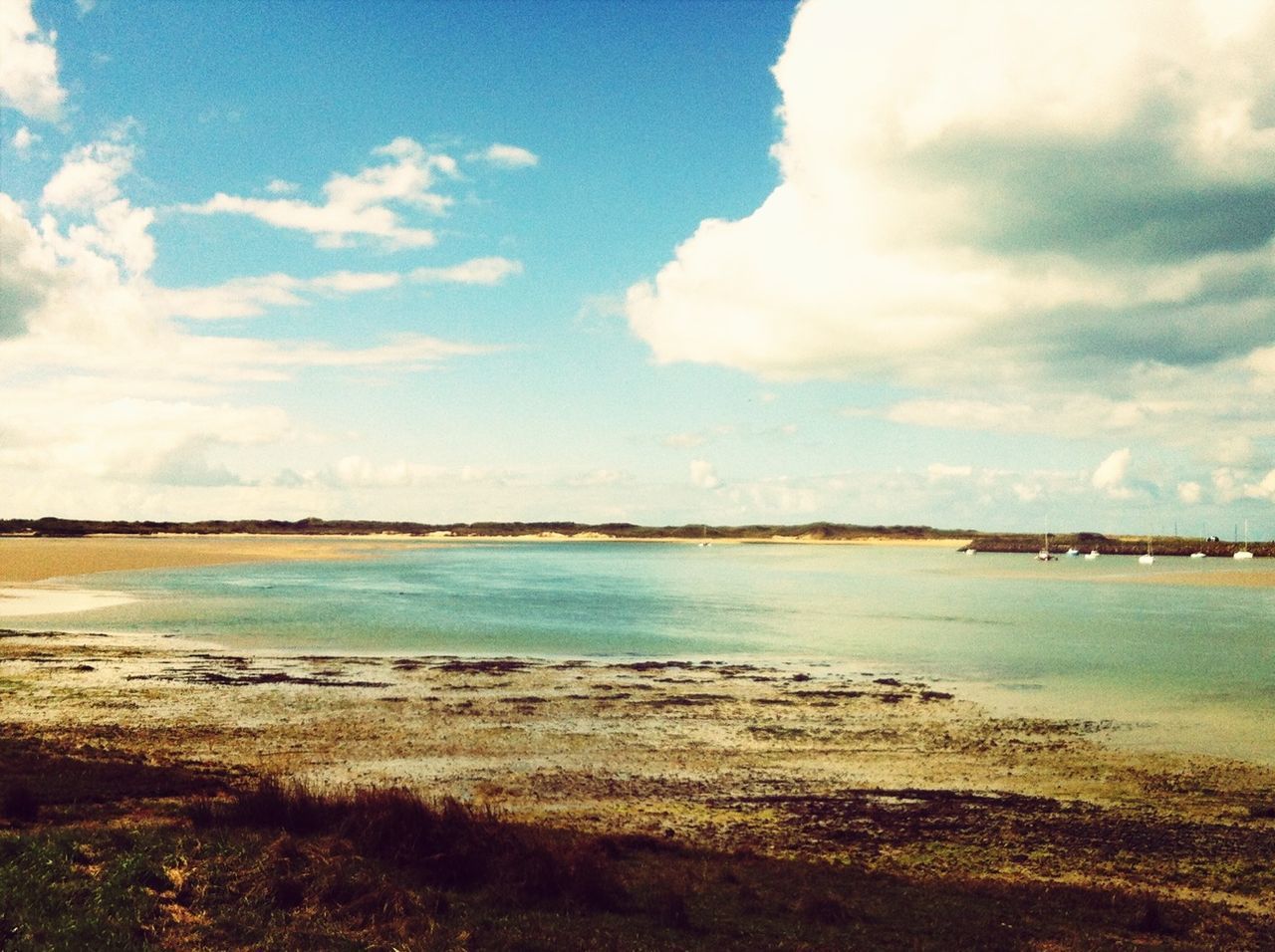 sky, water, tranquil scene, tranquility, cloud - sky, scenics, beauty in nature, beach, sea, nature, shore, blue, cloud, cloudy, idyllic, lake, calm, outdoors, sand, day