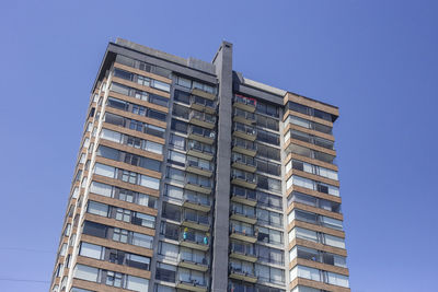 Low angle view of building against clear blue sky