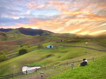 Scenic view of landscape against sky during sunset