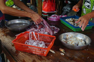 High angle view of man preparing food at market