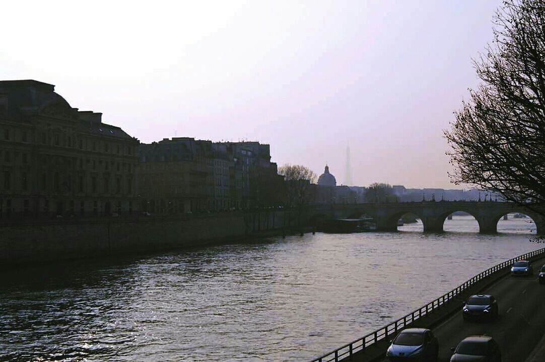 architecture, built structure, building exterior, water, river, connection, bridge - man made structure, city, clear sky, waterfront, bridge, canal, sky, reflection, copy space, transportation, arch bridge, outdoors, no people, building