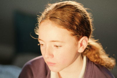 Close-up portrait of girl looking away