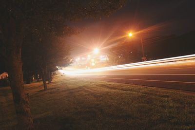 View of light trails on street at night