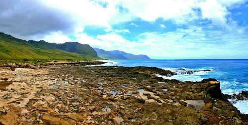 Scenic view of sea against cloudy sky