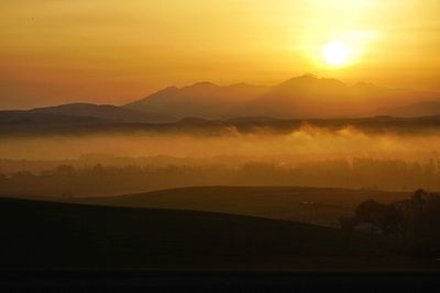 Scenic view of mountains at sunset