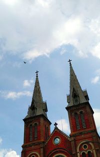 Low angle view of bell tower against sky