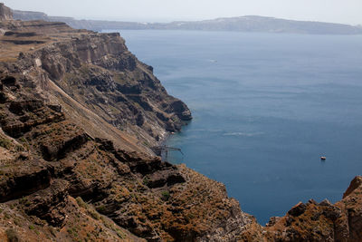 High angle view of sea and mountains against sky