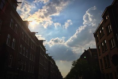 Low angle view of building against cloudy sky