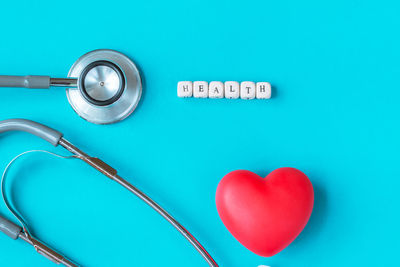 Close-up of heart shape on blue table