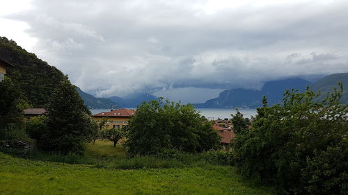 Scenic view of mountains against cloudy sky