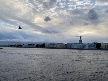View of buildings against cloudy sky