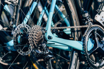 Close-up photo of rear wheel and cassette with chain on professional racing bicycle