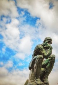 Low angle view of statue against sky