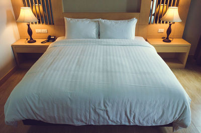 High angle view of bed in hotel room