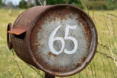 Close-up of rusty metal on field