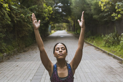 Women making yoga on the park