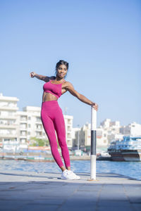 Woman exercising in city