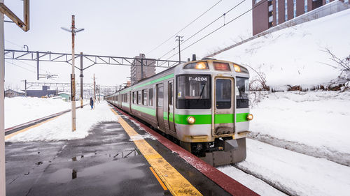 Train on railroad tracks during winter