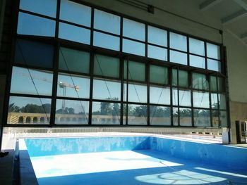 Reflection of building in swimming pool