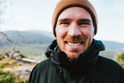 Portrait of smiling man in hat