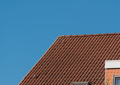 Low angle view of roof against clear blue sky