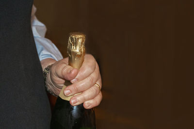 Close-up of man holding drink