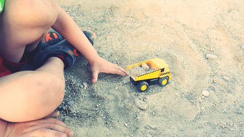 Low section of boy on beach