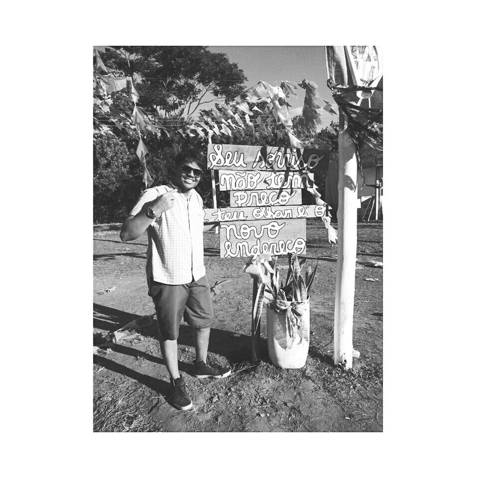 FULL LENGTH OF MAN STANDING ON COBBLESTONE