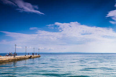 Scenic view of sea against blue sky