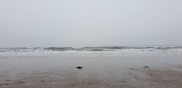 Scenic view of beach against clear sky