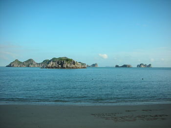 Scenic view of sea against blue sky