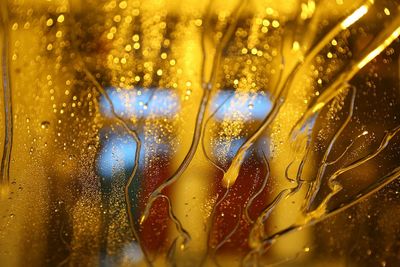 Close-up of wet car window at night