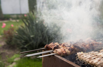 Close-up of meat on barbecue grill