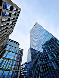Low angle view of modern buildings against sky
