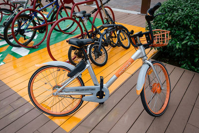 High angle view of bicycle parked on footpath