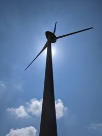 Low angle view of wind turbine against sky