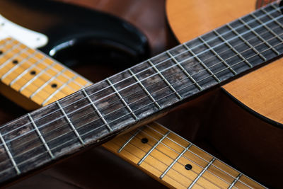 Close-up of guitar playing piano