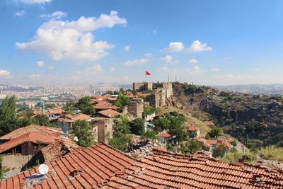 Scenic view of residential district against sky