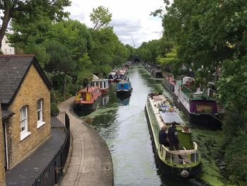 High angle view of river amidst trees against sky
