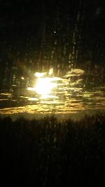 Close-up of water against sky during sunset