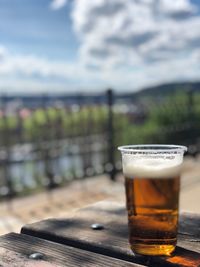 Close-up of beer glass on table