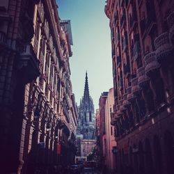 Low angle view of buildings in city against sky