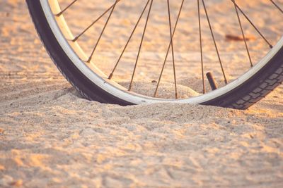 Close-up of bicycle wheel on street