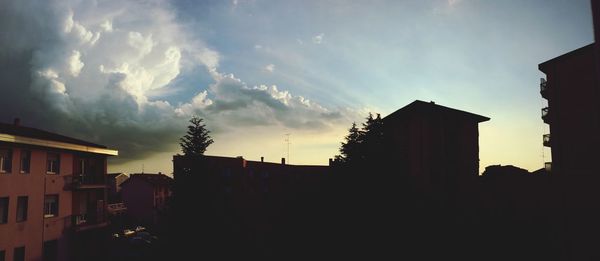 Low angle view of building against cloudy sky