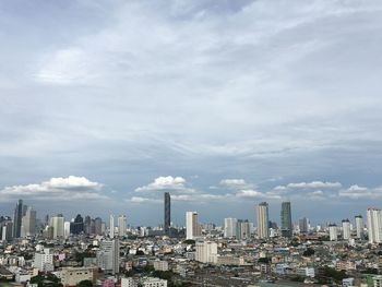 Modern buildings in city against sky