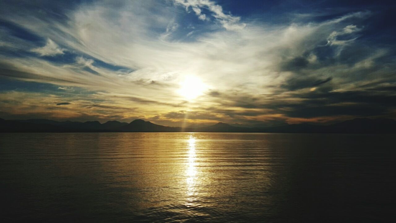 sunset, beauty in nature, scenics, sea, nature, water, cloud - sky, tranquil scene, tranquility, sky, idyllic, dramatic sky, horizon over water, outdoors, no people, sun, landscape, day