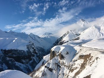 Scenic view of snowcapped mountains against sky