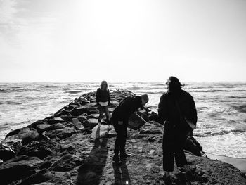 Group of people standing on a sea cliff