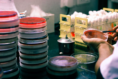 Close-up of person hands experimenting in laboratory